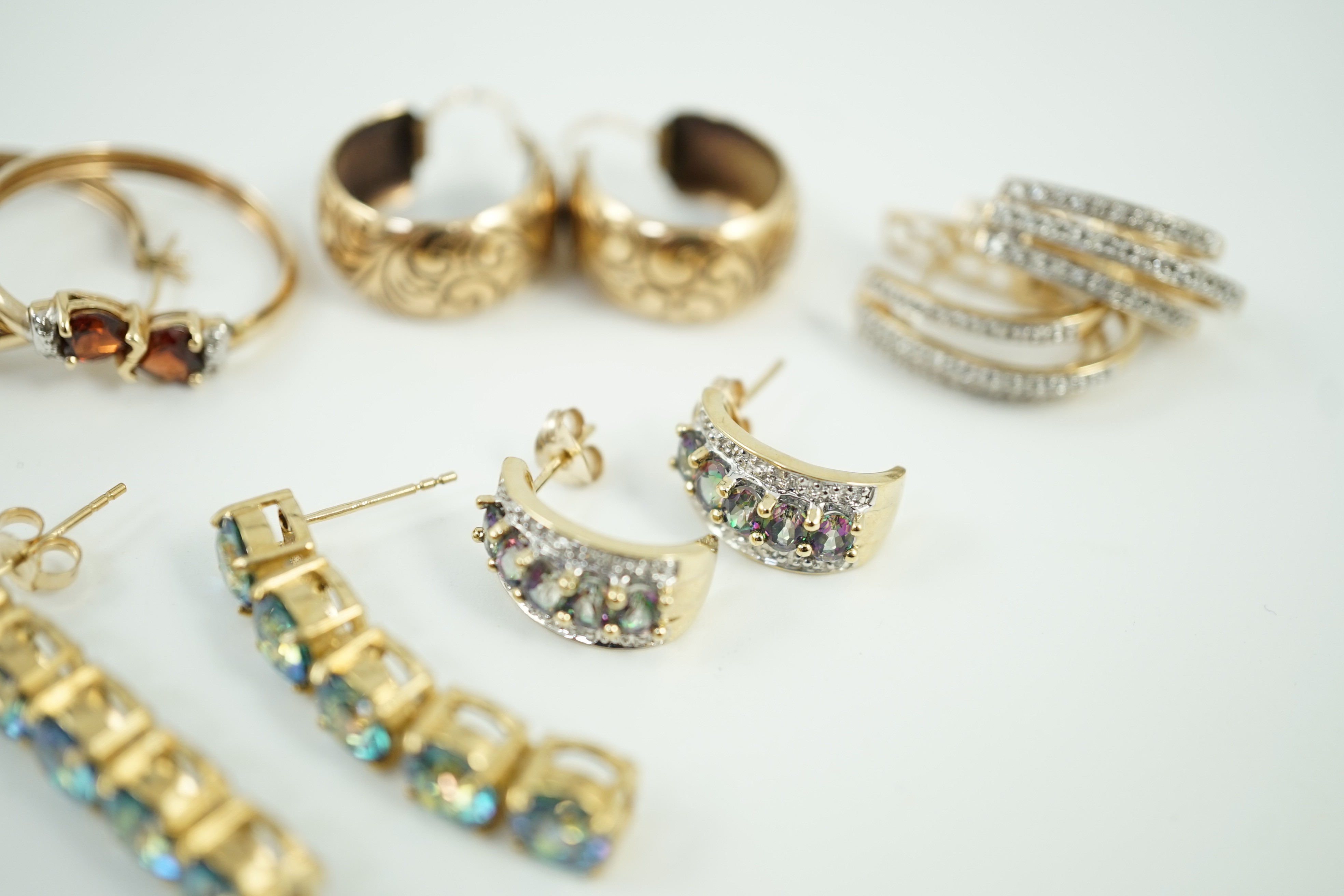 Four assorted modern pairs of 9ct gold and gem set earrings and one pair of yellow metal earrings, gross weight, 23.2 grams.